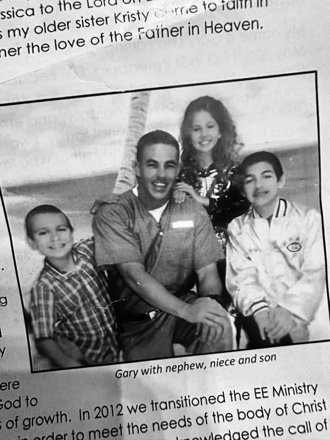 Gary during a prison visit with his son, nephew, and niece